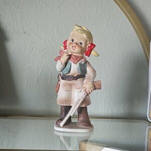 Charming Figurine with Red Accents